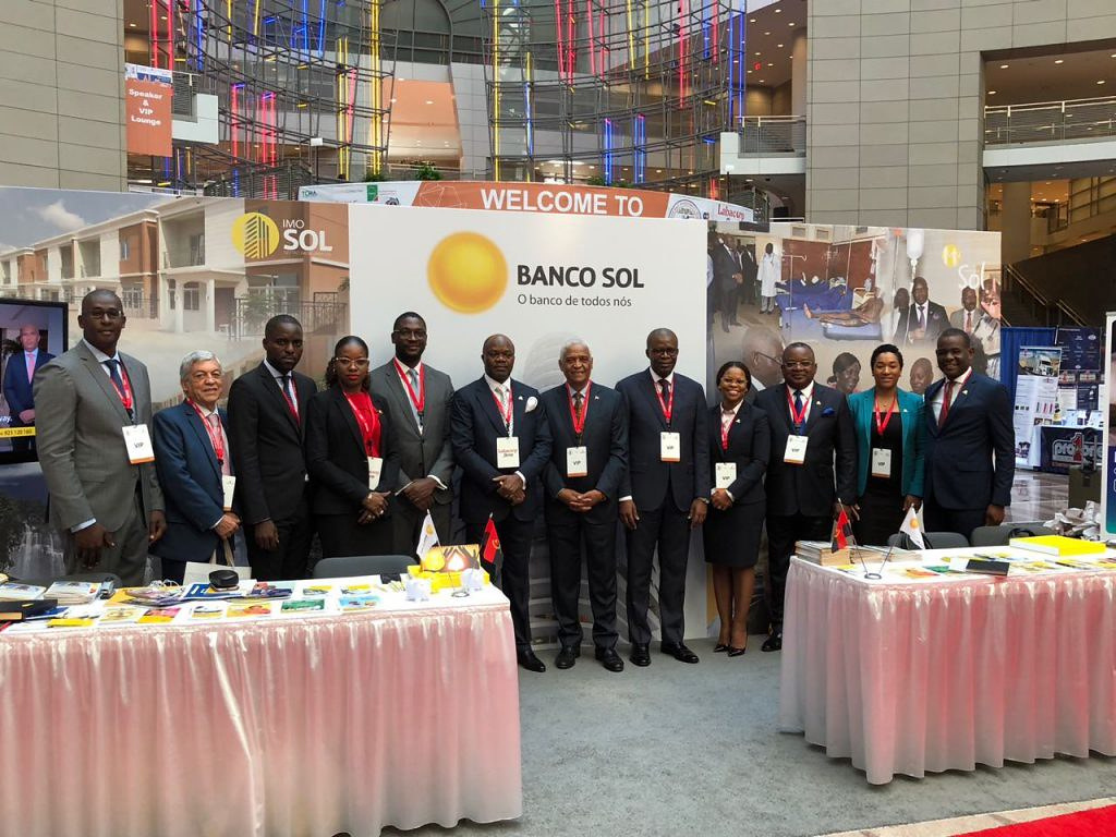 Delegation photographed at an ATIGS exhibition stand