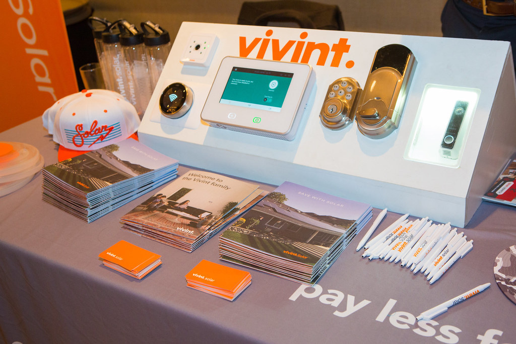 Branded promotional materials displayed on an exhibition counter