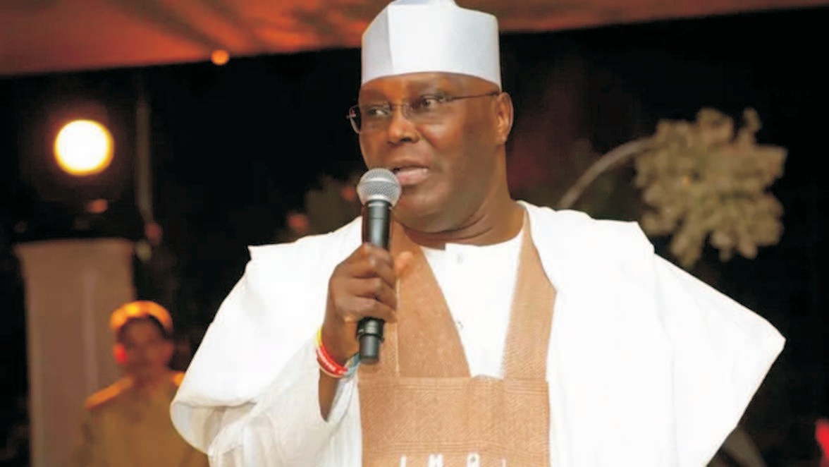 H.E Atiku Abubakar addressing an audience with a microphone