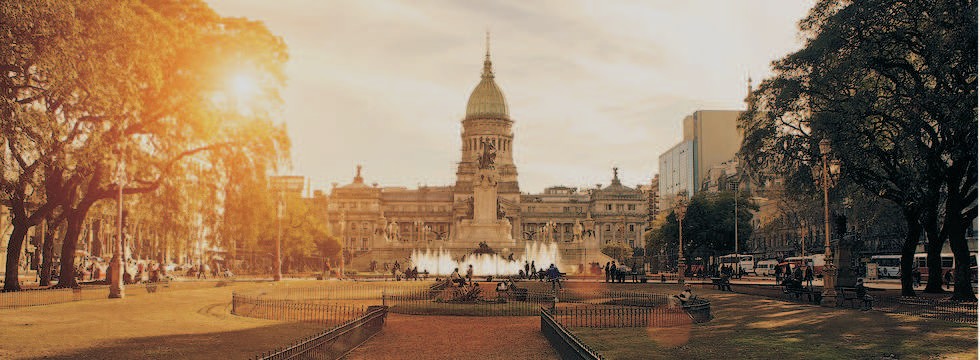 An ornate building with a fountain in front of it
